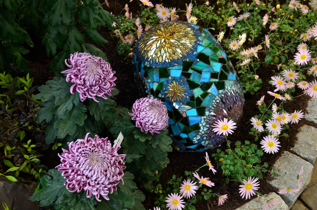 Glass Dragon Egg Surrounded by Flowers Glass Dragon Egg Surrounded by Flowers