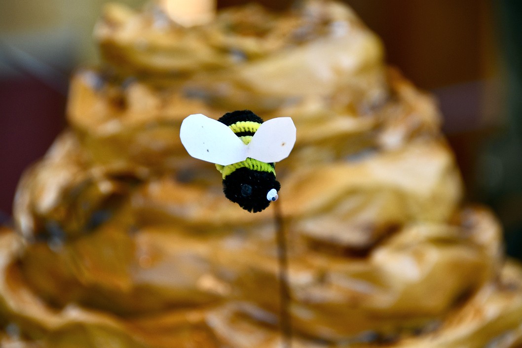 One-Eyed Bee Flying in Front of Their Hive